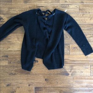 girl’s black cardigan